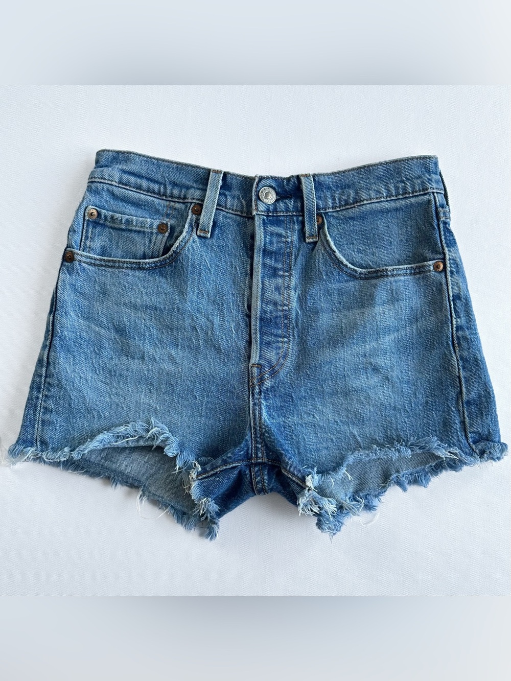 Levi’s 501 high rise blue denim shorts size 26 medium wash raw hem